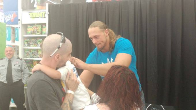 Big Cass signing a crying Nikki's t-shirt with care. Photo Credit: Mike & Austin Clarke